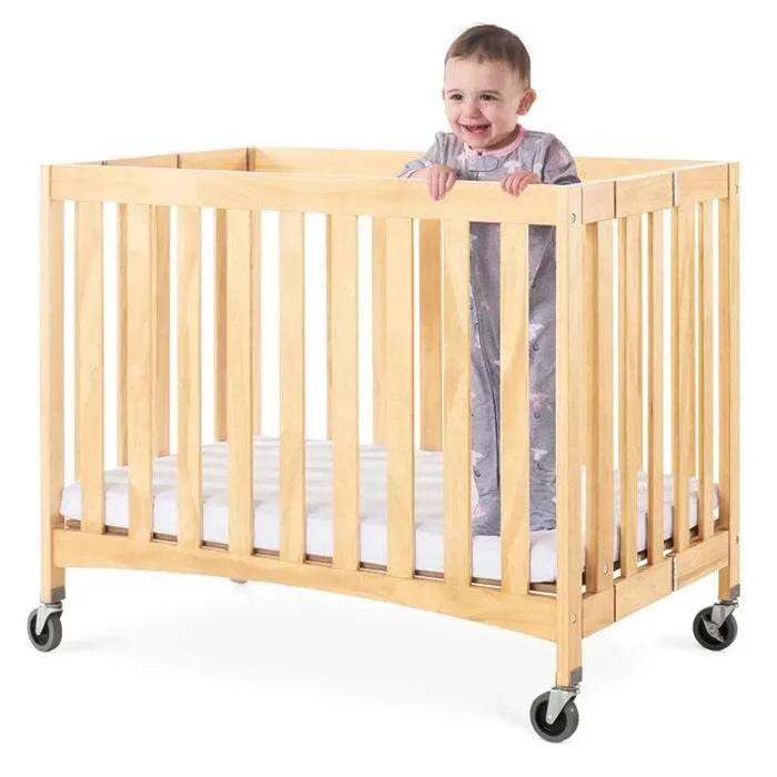 Foundations Travel Sleeper® Compact Folding Crib Slatted with Oversized Casters (Including Foam Mattress)