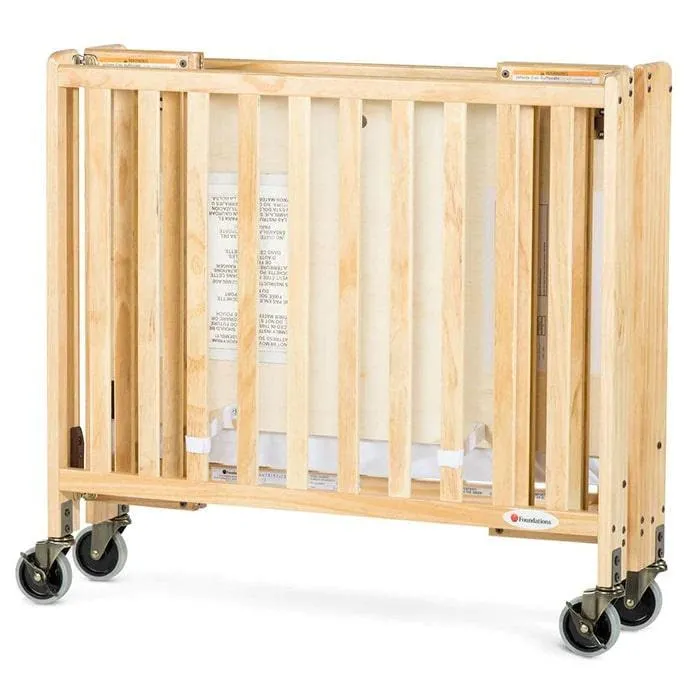 Foundations Travel Sleeper® Compact Folding Crib Slatted with Oversized Casters (Including Foam Mattress)